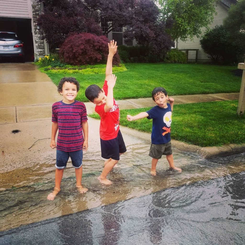 kids playing in the rain