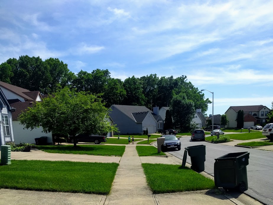 small kids walking away from home experiencing summer break learning loss