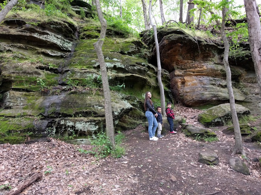 Family posing near cliffs at Rising Park in Lancaster