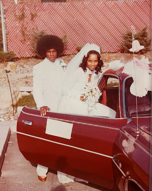 Groom escorting bride to car after getting married at McDonald's