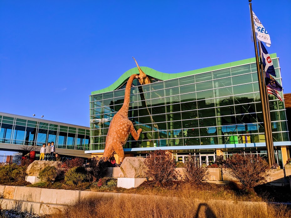 Dinosaur looking into Children's Museum of Indianapolis