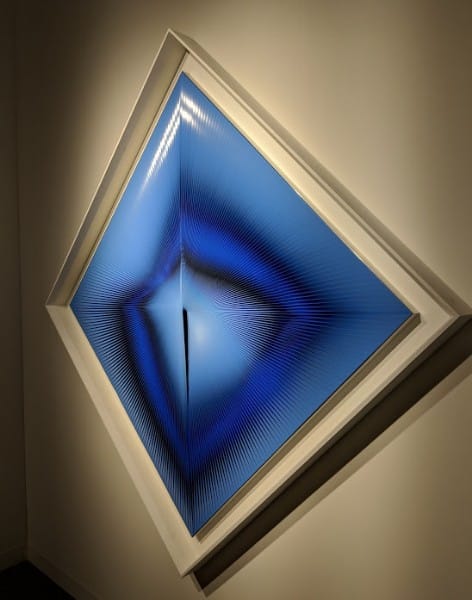 A blue painting in a diamond shape as seen at Art Basel 2018. 