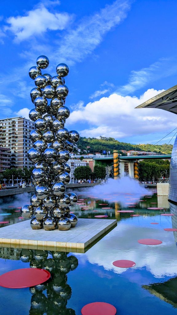 A sculpture made up of silver balls outside of Bilbao's Guggenheim Museum. 