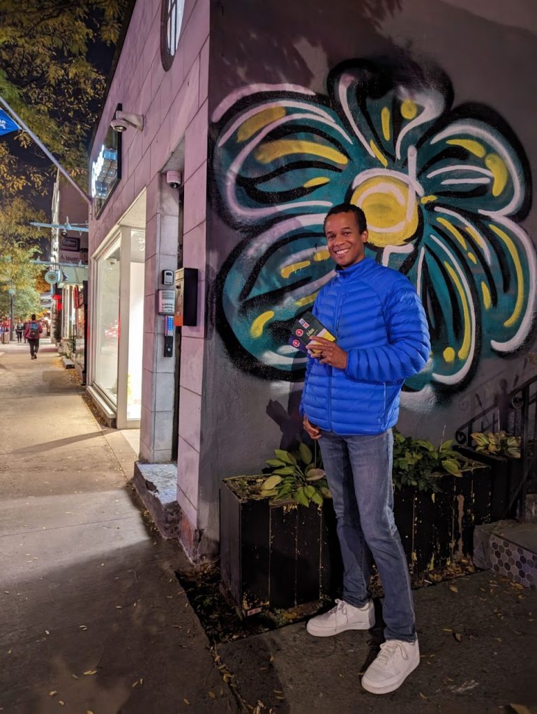 Author holding edibles outside of Montreal SQDC in Le Plateau 