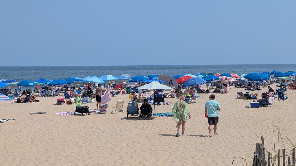 Crowded Rehoboth Beach, Delaware during a Monday in August. 